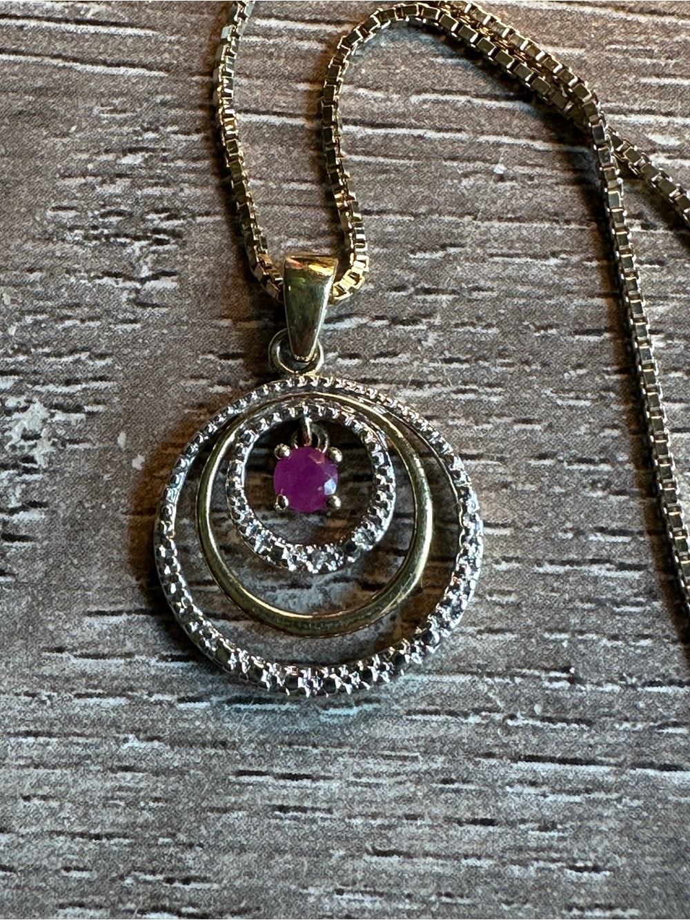 Sterling Silver Circle Pendant Necklace with Pink Ruby Accent